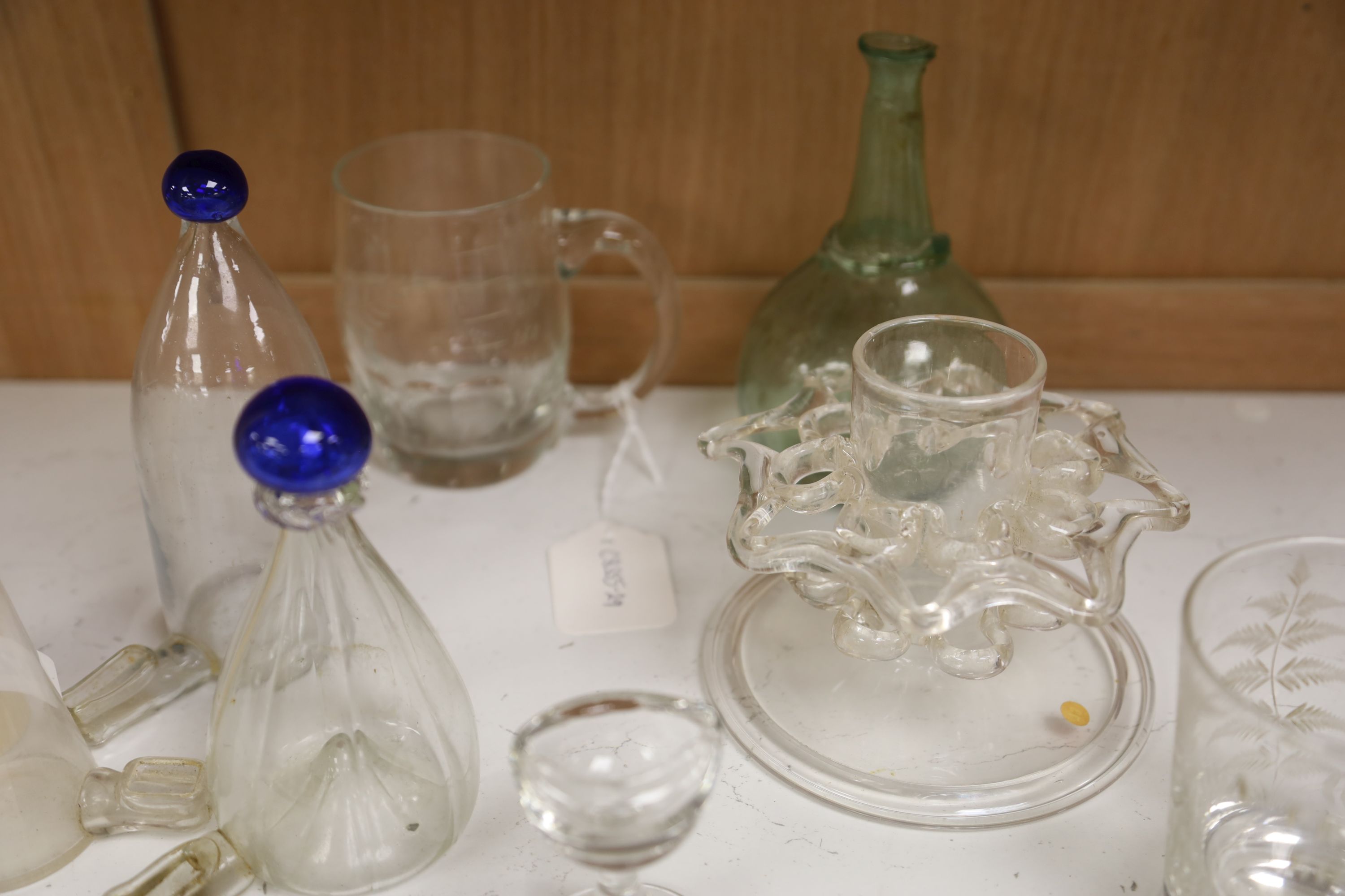 A small quantity of 19th century glass, including three late Georgian bird feeders and an eye bath